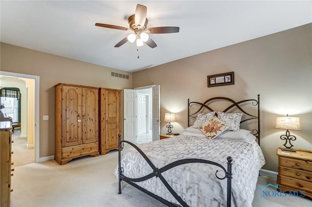 bedroom with light carpet and ceiling fan