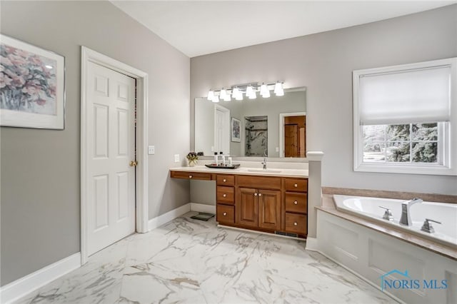 bathroom with vanity and independent shower and bath