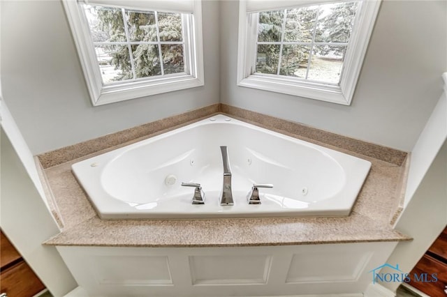 bathroom featuring a tub to relax in