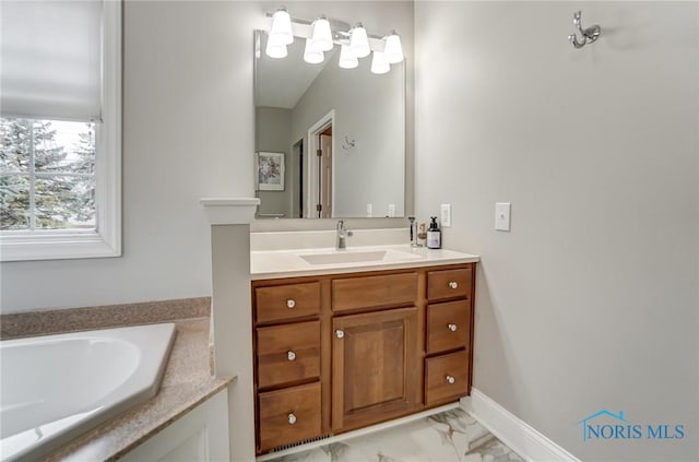 bathroom featuring vanity and a tub to relax in