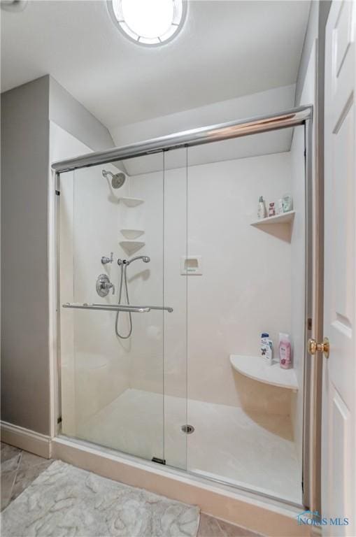 bathroom featuring walk in shower