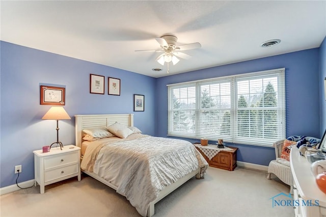 carpeted bedroom with ceiling fan