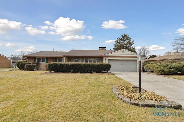 single story home featuring an attached garage, a front lawn, and concrete driveway