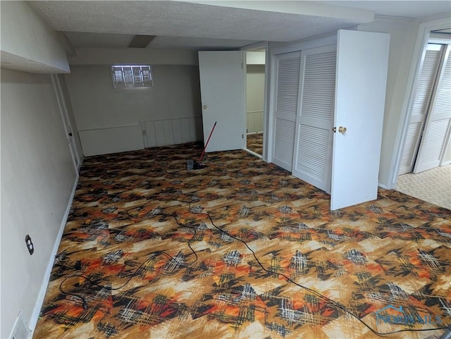 basement with a textured ceiling