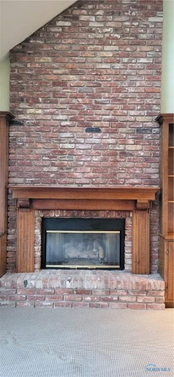 details featuring a brick fireplace