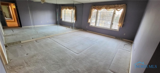 empty room featuring light carpet