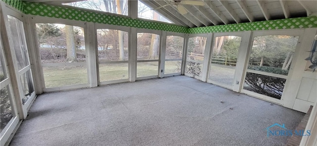 unfurnished sunroom featuring lofted ceiling and ceiling fan