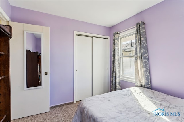 bedroom with a closet and carpet