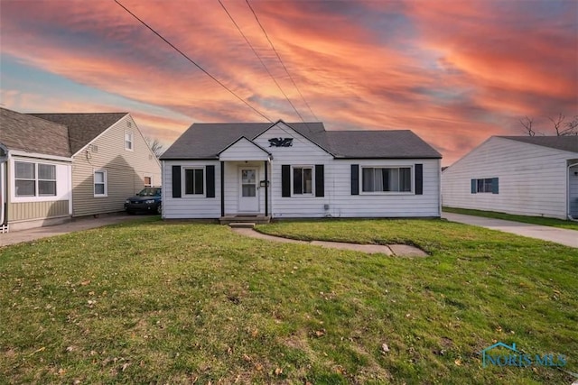 view of front of property with a lawn