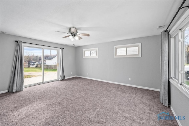 unfurnished room with ceiling fan and carpet flooring