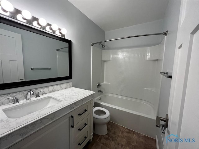 full bathroom featuring bathtub / shower combination, vanity, and toilet