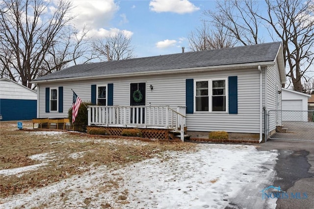 view of front of home featuring a garage and an outdoor structure