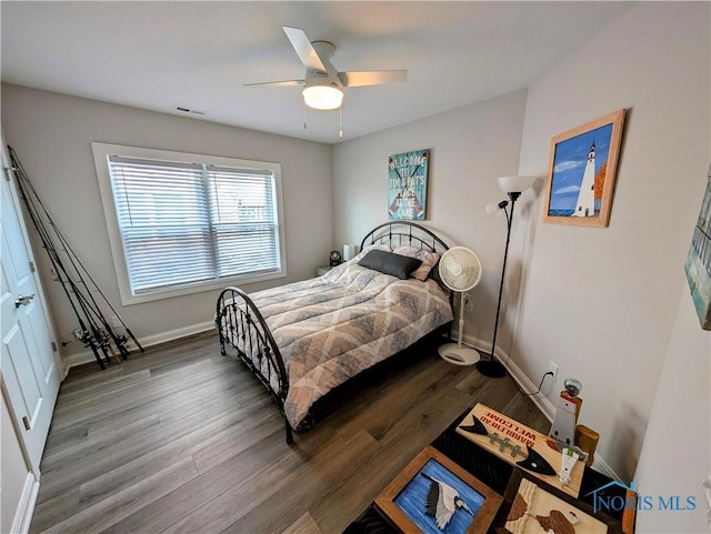 bedroom with hardwood / wood-style flooring and ceiling fan