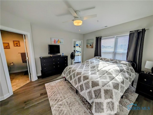 bedroom featuring ceiling fan and dark hardwood / wood-style flooring