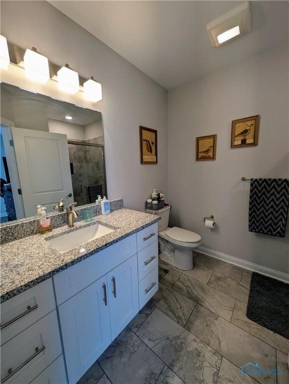 bathroom with walk in shower, vanity, and toilet