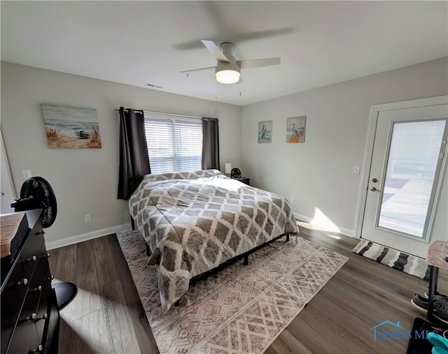 bedroom with dark wood-type flooring and ceiling fan