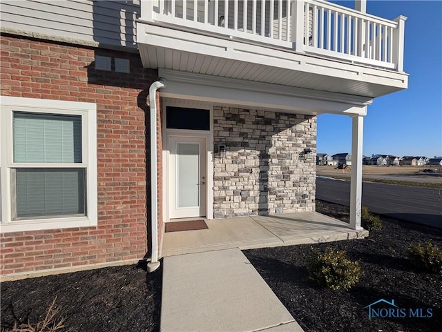 doorway to property with a balcony