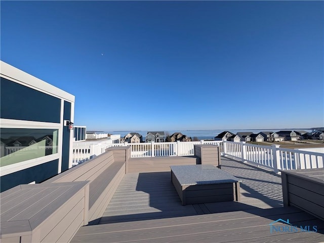 wooden terrace with a water view