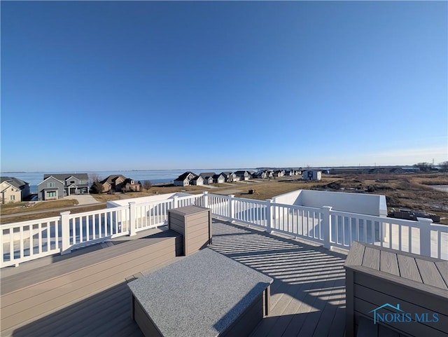 deck featuring a water view