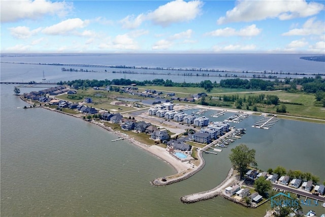 birds eye view of property with a water view