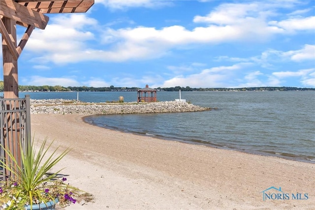 view of water feature with a beach view