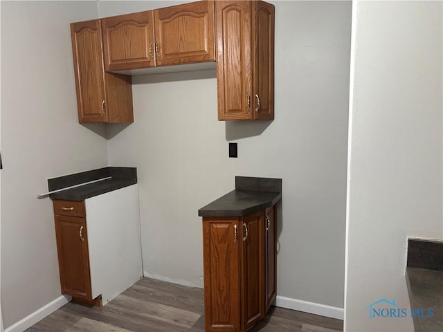 kitchen with dark wood-type flooring