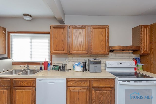 kitchen with sink, custom range hood, white appliances, and decorative backsplash