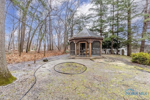 exterior space featuring a sunroom