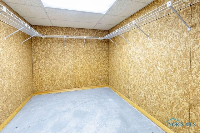 spacious closet featuring a paneled ceiling