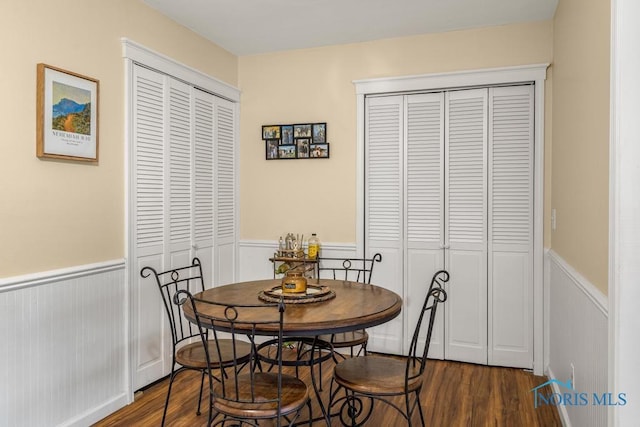 dining room with dark wood-type flooring