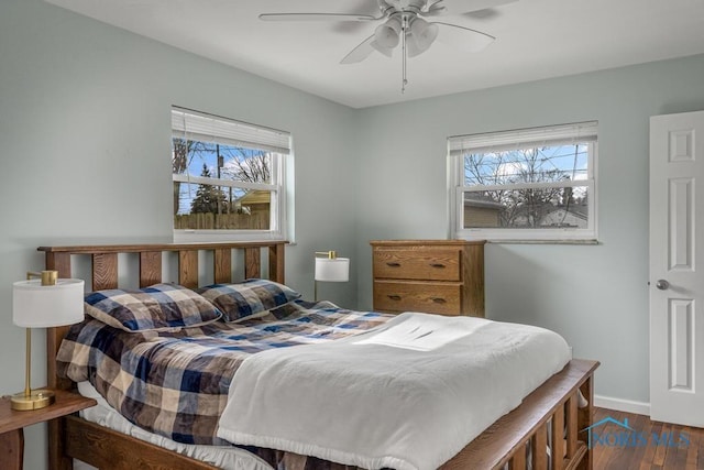 bedroom featuring ceiling fan and dark hardwood / wood-style flooring