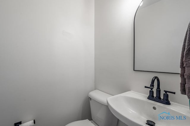 bathroom with toilet and sink