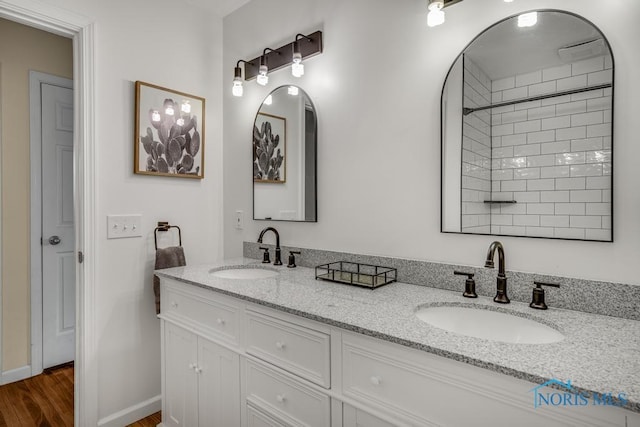 bathroom with vanity and hardwood / wood-style floors