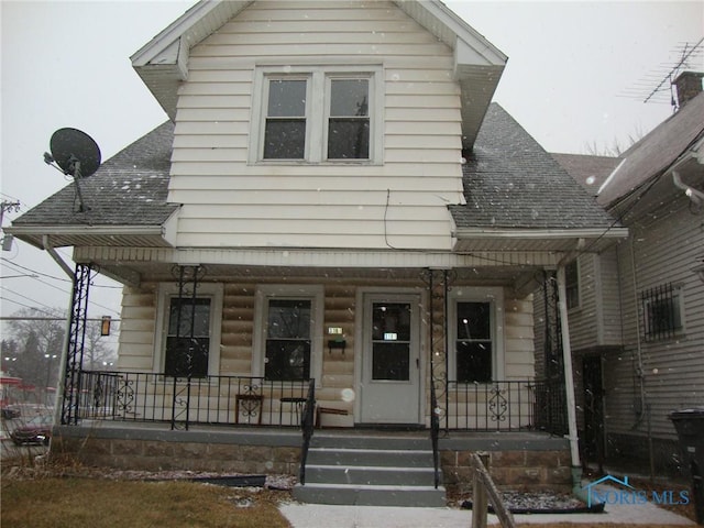 view of front of property featuring covered porch