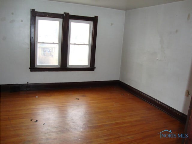 empty room featuring hardwood / wood-style floors