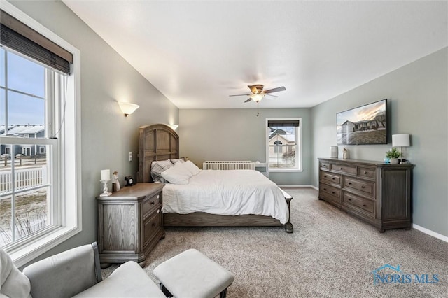 bedroom with light carpet and ceiling fan