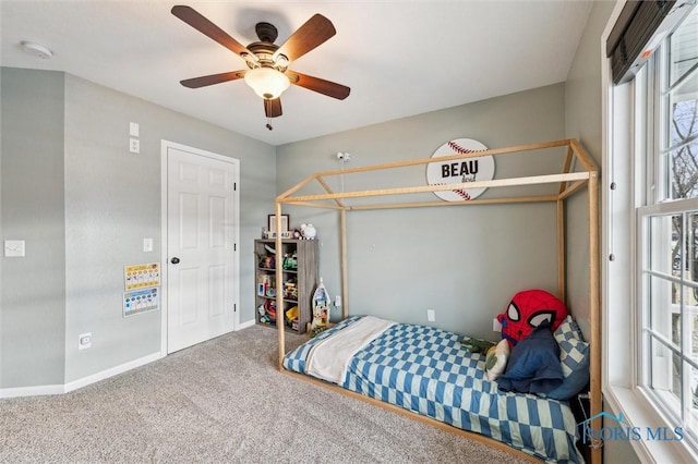 carpeted bedroom featuring ceiling fan