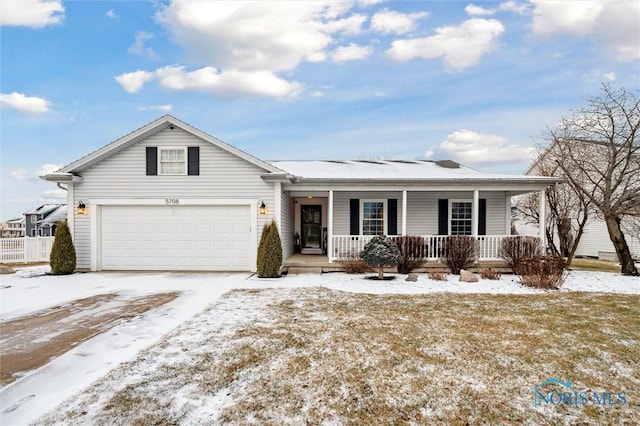 ranch-style home with a garage and covered porch