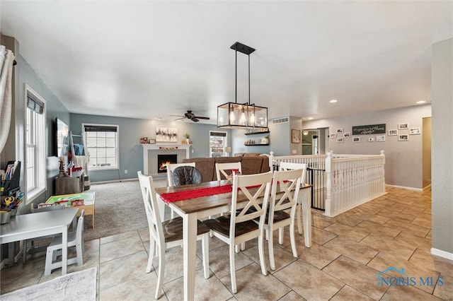 dining area featuring light tile patterned flooring and ceiling fan