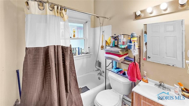 full bathroom with vanity, toilet, and shower / bath combo with shower curtain