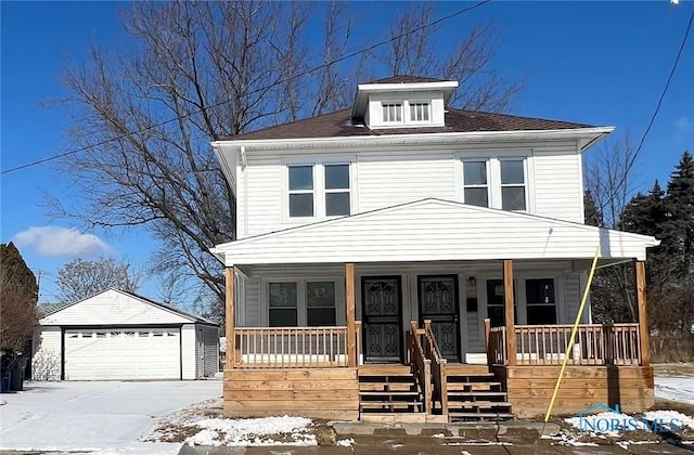 view of front of house featuring a garage, an outdoor structure, and covered porch