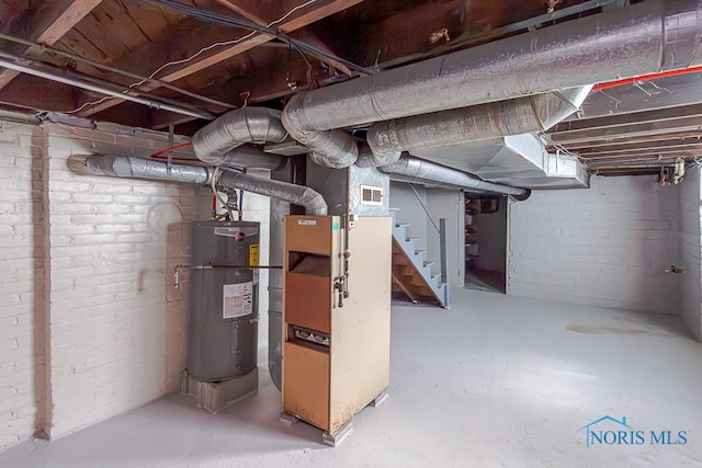 basement with heating unit and electric water heater