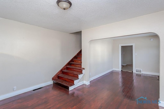 interior space featuring hardwood / wood-style floors and a textured ceiling