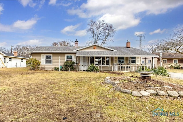 ranch-style home with a porch and a front yard