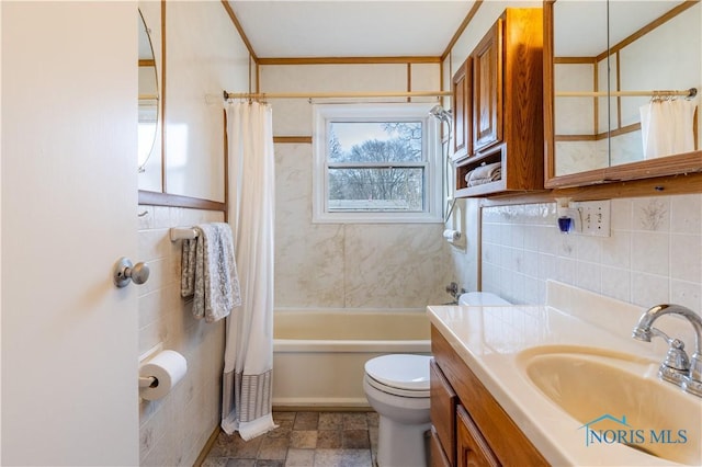 bathroom with toilet, vanity, shower / bath combination with curtain, and tile walls