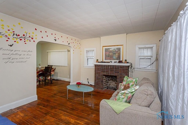 living room featuring hardwood / wood-style flooring and a fireplace