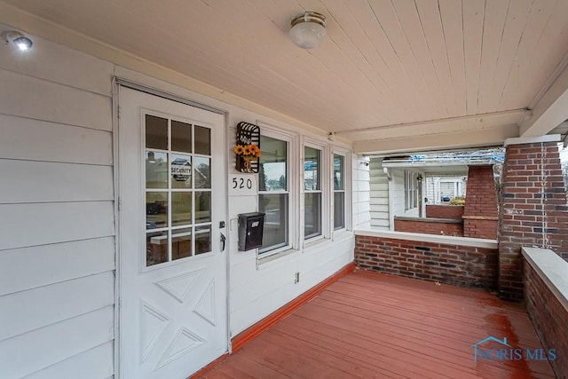 wooden deck featuring covered porch