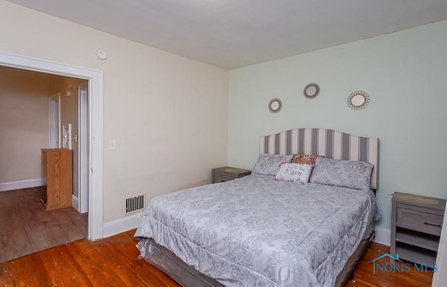 bedroom featuring dark hardwood / wood-style floors