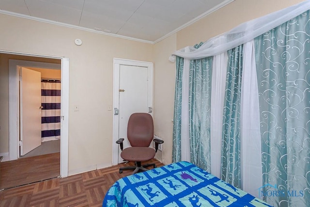 bedroom with crown molding and parquet flooring