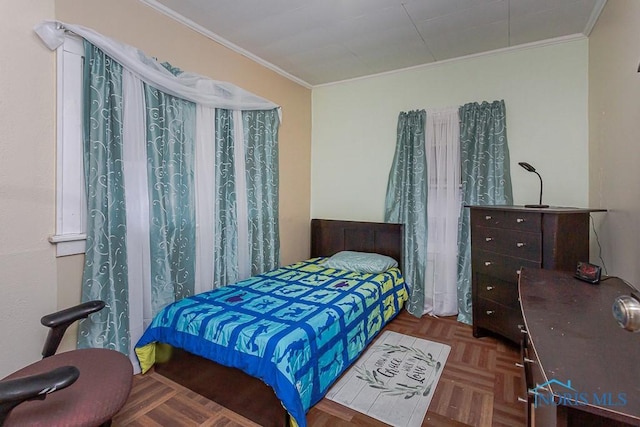 bedroom with parquet floors and crown molding